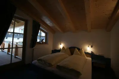 Ein Bett oder Betten in einem Zimmer der Unterkunft Dorfappartements Söll