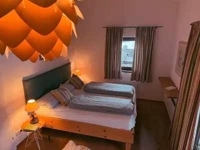Ein Bett oder Betten in einem Zimmer der Unterkunft Apartment Kitzkamm by Apartment Managers