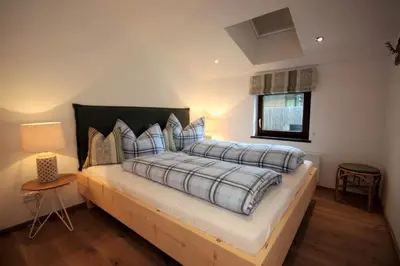 Ein Bett oder Betten in einem Zimmer der Unterkunft Apartment Kitzkamm by Apartment Managers