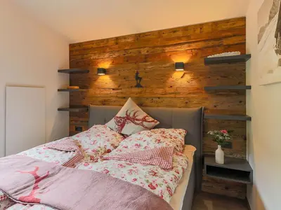 Ein Bett oder Betten in einem Zimmer der Unterkunft Modern penthouse with balcony in Gasteig