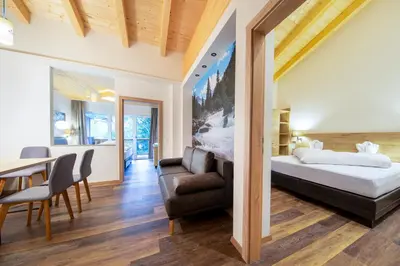 Ein Bett oder Betten in einem Zimmer der Unterkunft Hotel Post Krimml