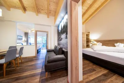 Ein Bett oder Betten in einem Zimmer der Unterkunft Hotel Post Krimml