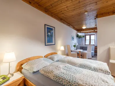 Ein Bett oder Betten in einem Zimmer der Unterkunft Hotel Baumgarten & Chalet Baumgarten