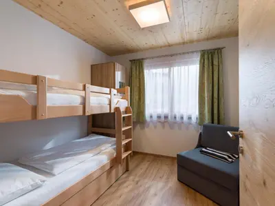 Ein Bett oder Betten in einem Zimmer der Unterkunft Hotel Baumgarten & Chalet Baumgarten