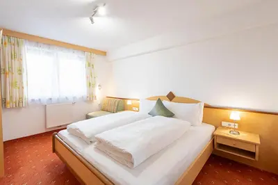 Ein Bett oder Betten in einem Zimmer der Unterkunft Apart Fankhauser