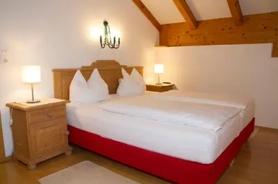 Ein Bett oder Betten in einem Zimmer der Unterkunft Apartmenthaus Brixen & Haus Central