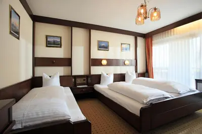 Ein Bett oder Betten in einem Zimmer der Unterkunft Apartmenthaus Brixen & Haus Central