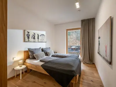 Ein Bett oder Betten in einem Zimmer der Unterkunft Ferienwohnung Hammerwirt