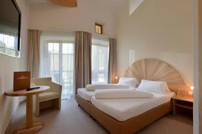 Ein Bett oder Betten in einem Zimmer der Unterkunft Hotel Kraftquelle Schlossblick