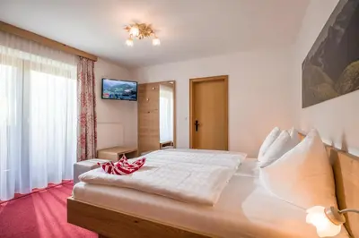 Ein Bett oder Betten in einem Zimmer der Unterkunft Pension Sonnblick