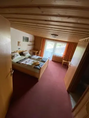 Ein Bett oder Betten in einem Zimmer der Unterkunft Pension Leitenhof