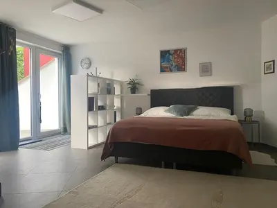Ein Bett oder Betten in einem Zimmer der Unterkunft Apartment LUIZ