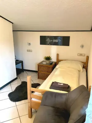 Ein Bett oder Betten in einem Zimmer der Unterkunft Hotel Wildrose