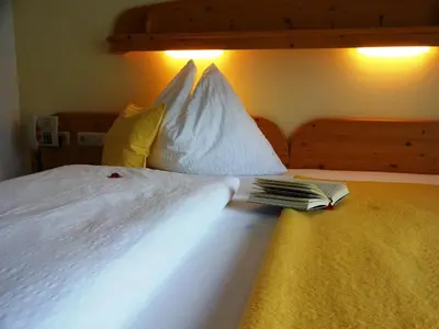 Ein Bett oder Betten in einem Zimmer der Unterkunft Pension Wolfsegg