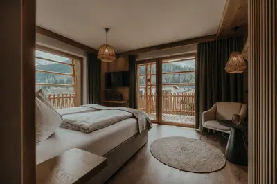 Ein Bett oder Betten in einem Zimmer der Unterkunft FRÄULEIN NANNERL - Boutique Apart mit Saunahaus