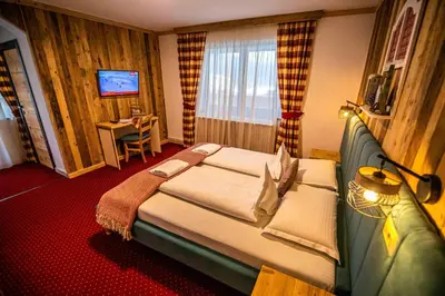 Ein Bett oder Betten in einem Zimmer der Unterkunft KITZALPEN Pension