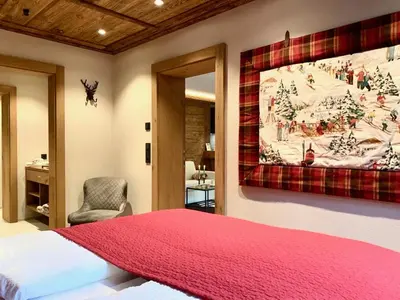 Ein Bett oder Betten in einem Zimmer der Unterkunft ALPIN CHARME APARTMENTS Boutique Chalet Kitzbichl
