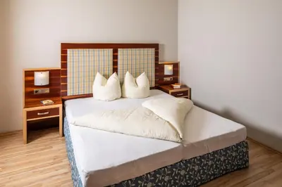 Ein Bett oder Betten in einem Zimmer der Unterkunft Apparthaus & Chalets Hofer