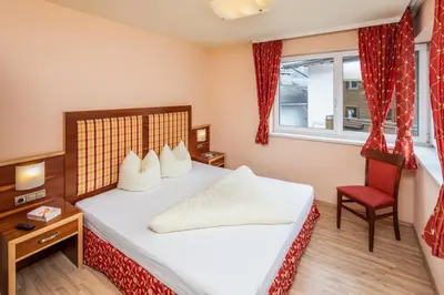Ein Bett oder Betten in einem Zimmer der Unterkunft Apparthaus & Chalets Hofer