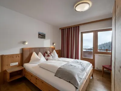 Ein Bett oder Betten in einem Zimmer der Unterkunft Berghaus Koglmoos