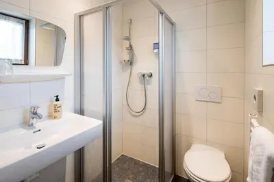 Ein Badezimmer in der Unterkunft Hotel Standlhof Zillertal