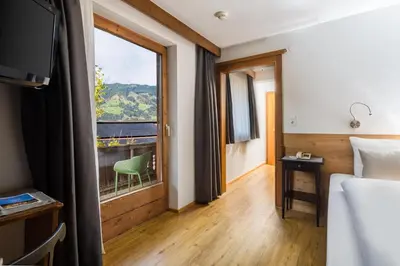 Ein Bett oder Betten in einem Zimmer der Unterkunft Hotel Standlhof Zillertal