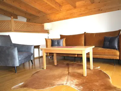 Ein Sitzbereich in der Unterkunft Kaiserapart Steinadler - ELLMAU Zentrum