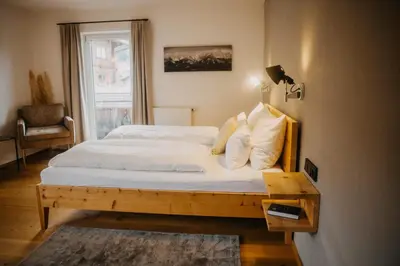 Ein Bett oder Betten in einem Zimmer der Unterkunft Hotel Alpin Tyrol - Kitzbüheler Alpen