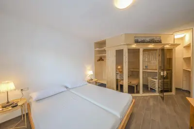 Ein Bett oder Betten in einem Zimmer der Unterkunft Appartementhaus Chalet Alpina
