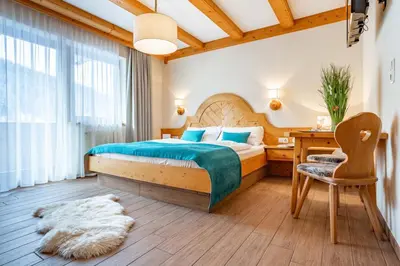 Ein Bett oder Betten in einem Zimmer der Unterkunft Berghotel Ronach