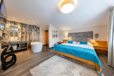 Ein Bett oder Betten in einem Zimmer der Unterkunft Berghotel Ronach