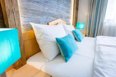 Ein Bett oder Betten in einem Zimmer der Unterkunft Berghotel Ronach