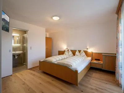 Ein Bett oder Betten in einem Zimmer der Unterkunft Apartment-Pension Schmiedererhof