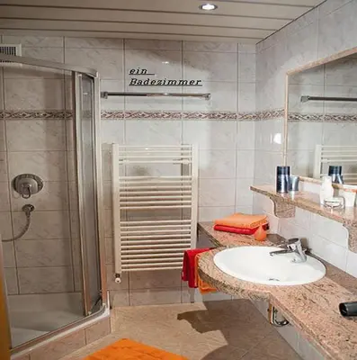 Ein Badezimmer in der Unterkunft Gästehaus Alpina