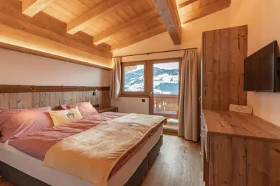 Ein Bett oder Betten in einem Zimmer der Unterkunft Berggasthof Staudachstub'n