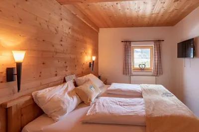 Ein Bett oder Betten in einem Zimmer der Unterkunft Berggasthof Staudachstub'n