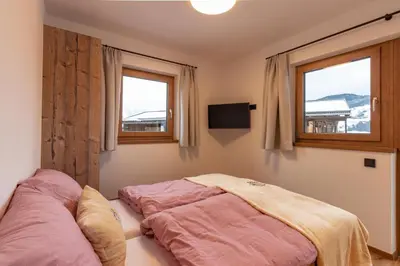 Ein Bett oder Betten in einem Zimmer der Unterkunft Berggasthof Staudachstub'n