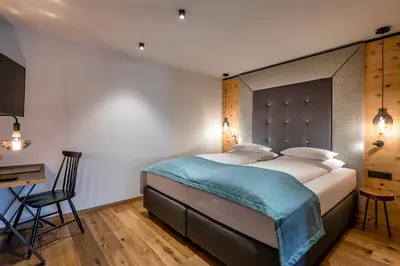 Ein Bett oder Betten in einem Zimmer der Unterkunft Hotel das Zwölferhaus