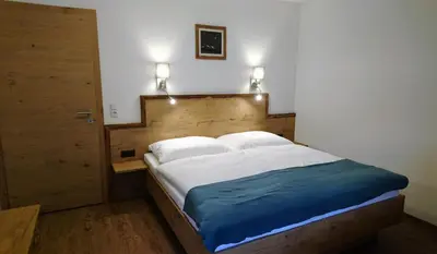 Ein Bett oder Betten in einem Zimmer der Unterkunft Apart Troppmair