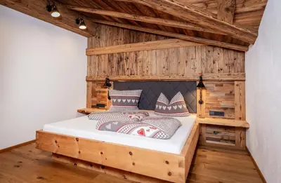Ein Bett oder Betten in einem Zimmer der Unterkunft Alpen Chalet Wohnung 