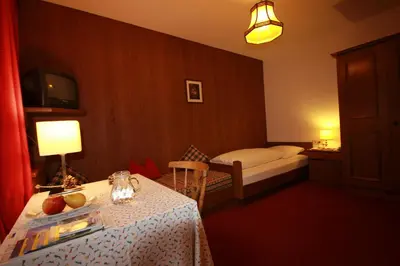 Ein Bett oder Betten in einem Zimmer der Unterkunft Pension Mühlbachhof