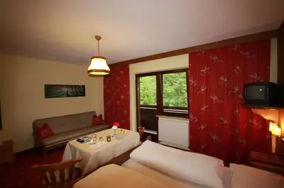 Ein Bett oder Betten in einem Zimmer der Unterkunft Pension Mühlbachhof