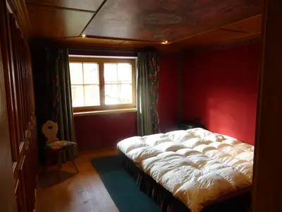 Ein Bett oder Betten in einem Zimmer der Unterkunft Alpenchalet