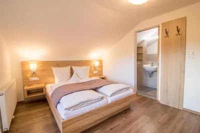 Ein Bett oder Betten in einem Zimmer der Unterkunft Haus am See - Ferienhaus Reintal