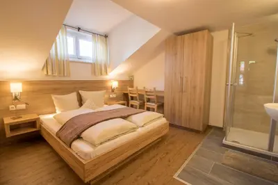Ein Bett oder Betten in einem Zimmer der Unterkunft Haus am See - Ferienhaus Reintal