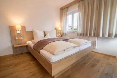 Ein Bett oder Betten in einem Zimmer der Unterkunft Haus am See - Ferienhaus Reintal