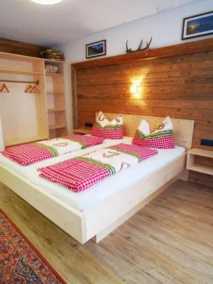 Ein Bett oder Betten in einem Zimmer der Unterkunft Ferienwohnung Brugger