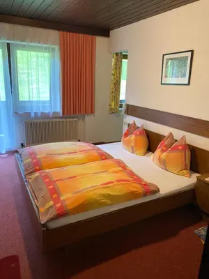 Ein Bett oder Betten in einem Zimmer der Unterkunft Gästehaus Hochwimmer