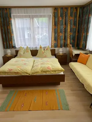 Ein Bett oder Betten in einem Zimmer der Unterkunft Gästehaus Hochwimmer