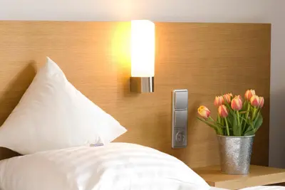Ein Bett oder Betten in einem Zimmer der Unterkunft Hotel Bräuwirt